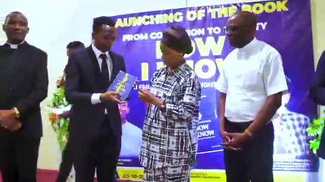 Launch day at Msimbazi: the first copy handed over.