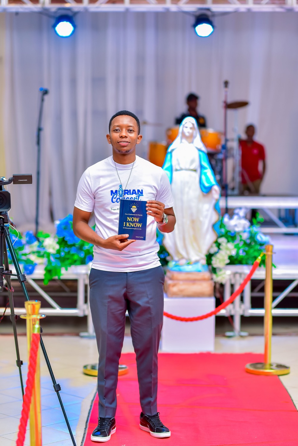 With the book before the shrine of Our Lady.